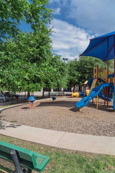 Bench and playground with colorful structure equipment near Dallas, Texas — Stock Photo, Image