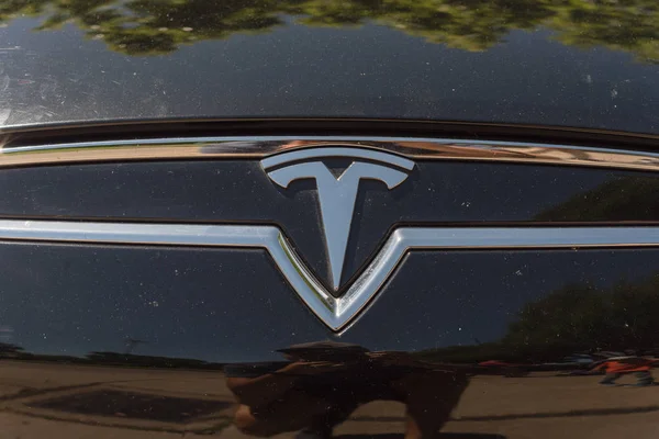 Black car hood cover with Tesla logo close-up — Stock Photo, Image