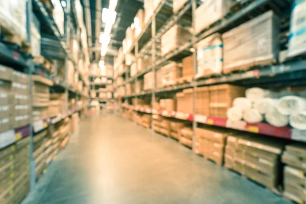 Filtered image blurry background variety of mattress on shelves at furniture warehouse