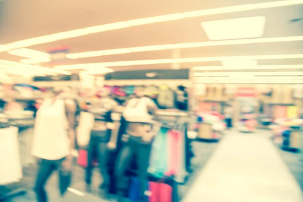 Filtered image blurry background mannequins at American sport and fitness clothing store