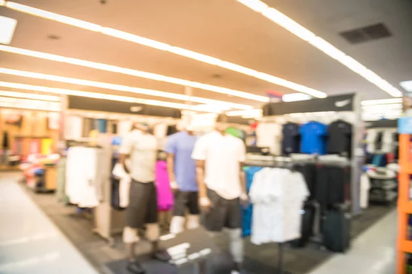 Blurry background mannequins at American sport and fitness clothing store