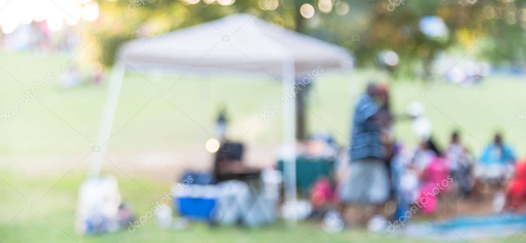 Panoramic view blurry background resident enjoy BBQ and camping at local park in USA