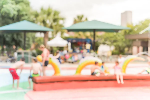 Fondo borroso diversos niños jugando en la almohadilla de salpicadura de agua en Houston, Texas —  Fotos de Stock