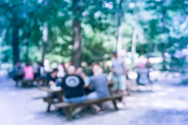 Blurry background local resident enjoy beer garden at brewing in Texas, USA