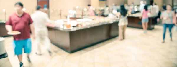 Panoramic view blurry background chef serving fresh food at Vietnamese buffet restaurant