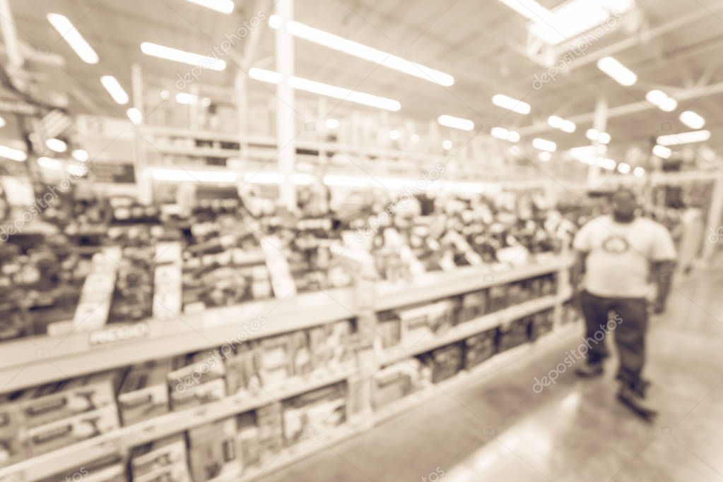 Filtered image blurry background customer shopping for power tools at home improvement store
