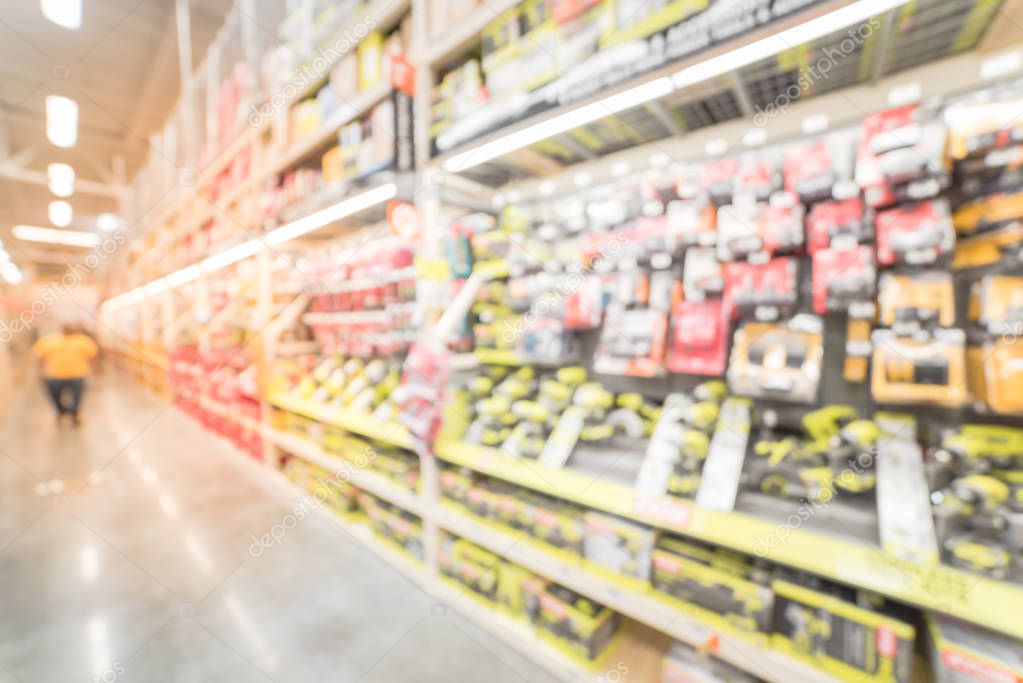Blurry background customer shopping for power tools at home improvement store in USA