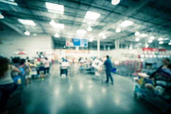 Filtered image blurry background busy checkout line at wholesale big-box store in America — Stock Photo, Image