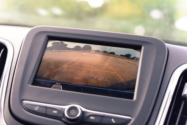 Rear view system monitor on dash camera backup at parking lots