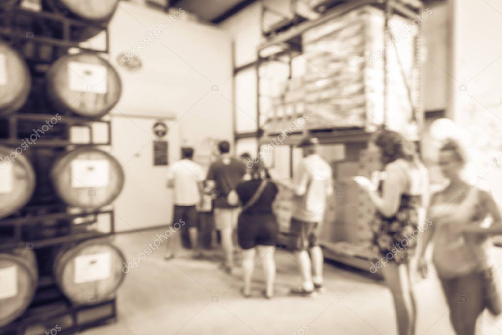Filtered image blurry background customer queue to taste draft beer at brewing taproom