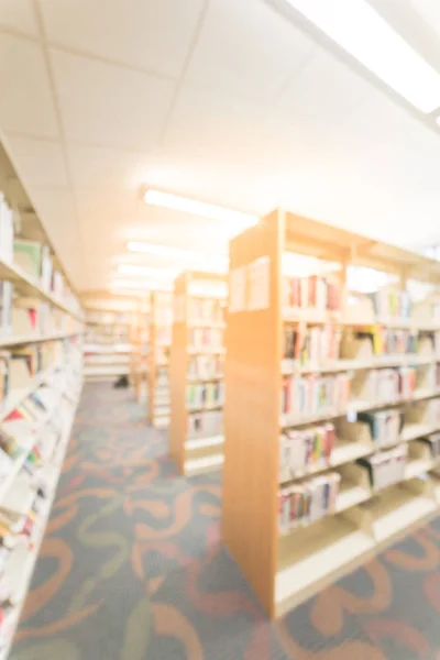 Blurry background aisle of bookshelf with step stool at American public library — Stock Photo, Image