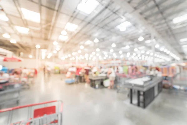 Blurry background busy checkout line at wholesale big-box store in America