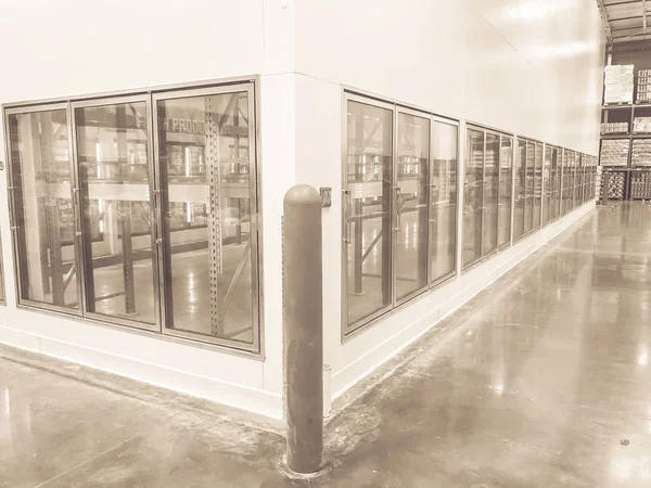 Vintage tone row of empty commercial fridges at wholesale big-box store