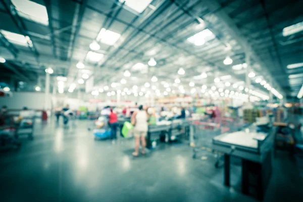 Filtered image blurry background busy checkout line at wholesale big-box store in America — Stock Photo, Image