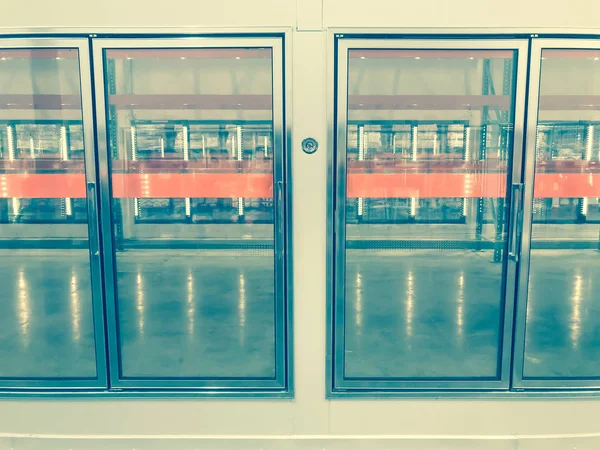 Large empty commercial fridges with temperature control at wholesale big-box store