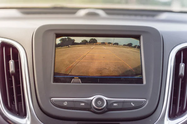 Rear view system monitor on dash camera backup at parking lots