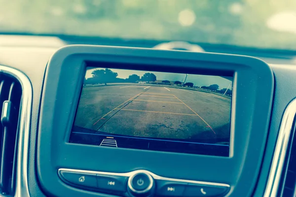 Rear view system monitor on dash camera backup at parking lots