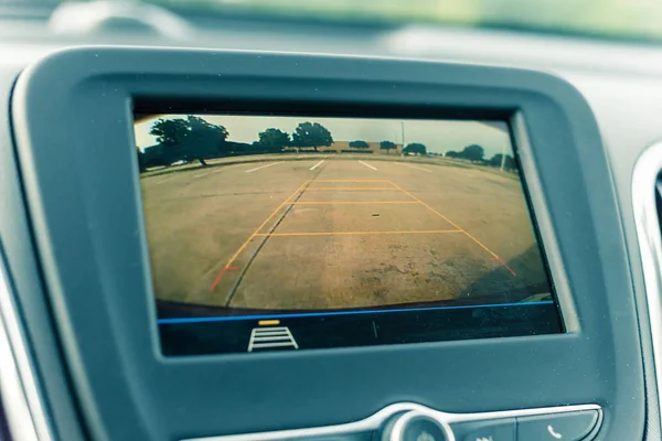 Rear view system monitor on dash camera backup at parking lots