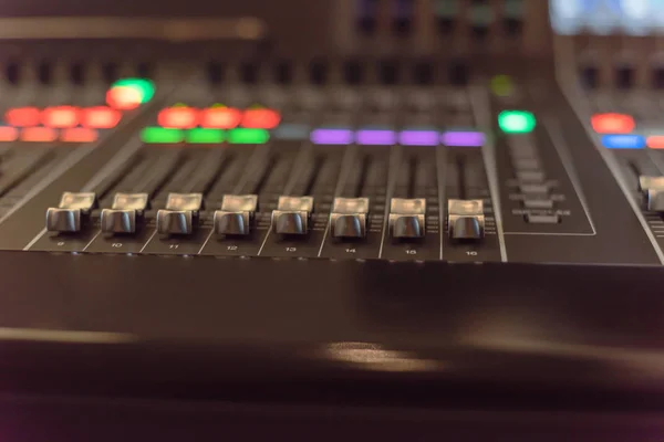 Colorful sound mixer control DJ turntable close-up