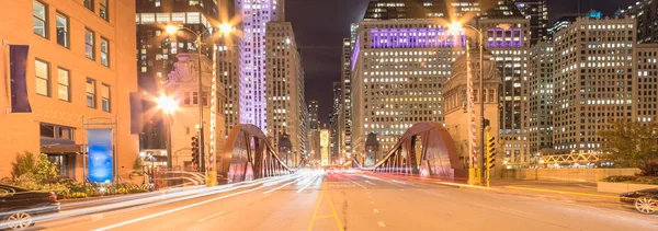Panoramic light trails and office buildings at North LaSalle Street bridge in downtown Chicago at night — Stock Photo, Image