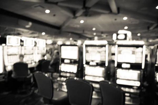 Filtered tone blurry background typical casino in America with slot machines and themed game