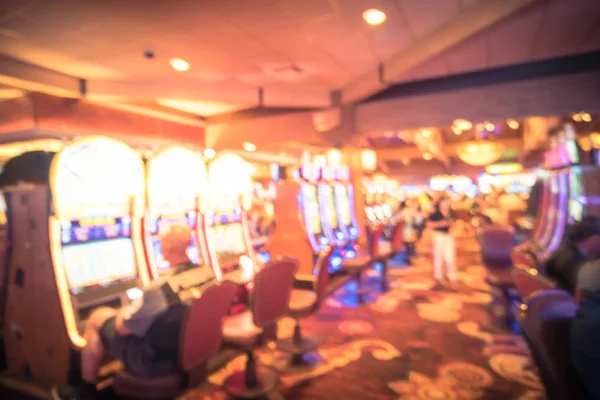 Blurry background typical casino in America with slot machines and themed game