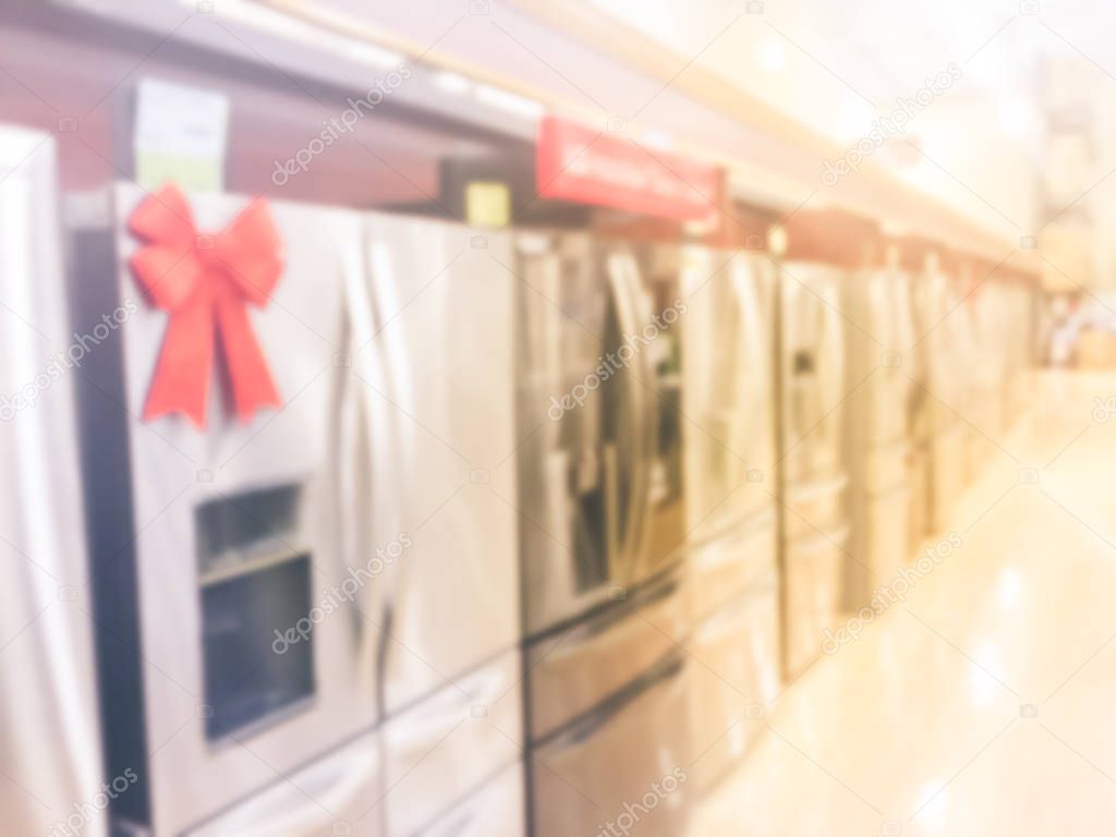 Filtered image blurry background rows of brand new French door refrigerators with ice makers