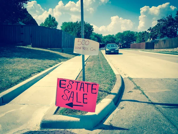 Filtered image red estate sale sign with address near Dallas