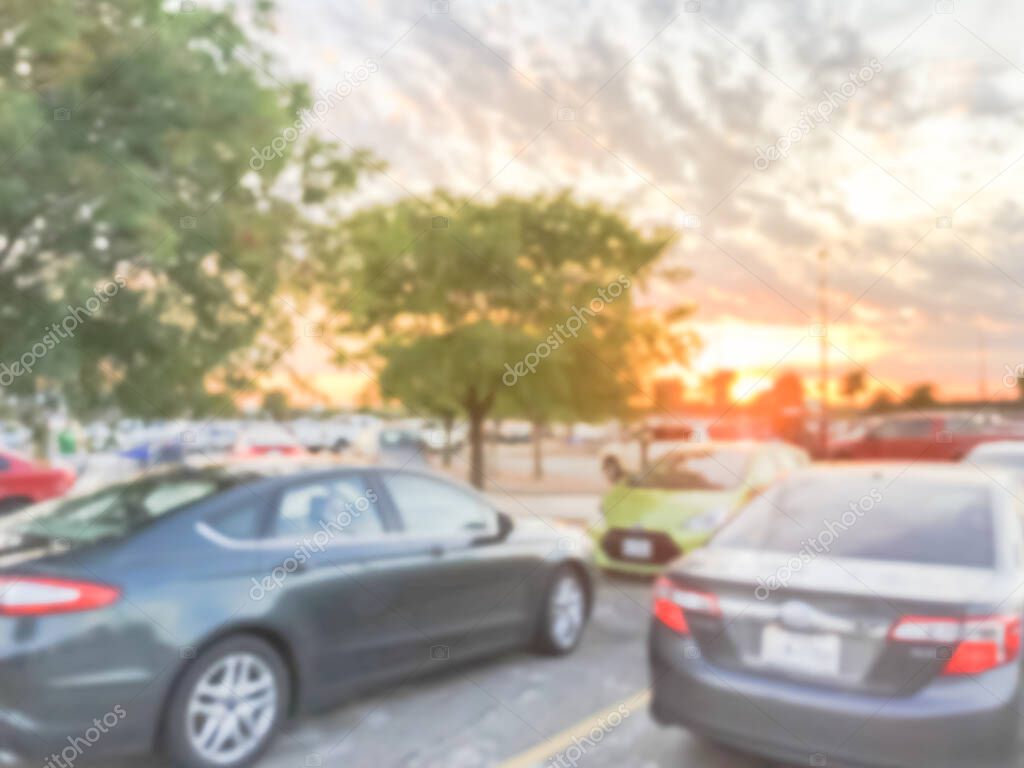 Blurry background outdoor parking garage with beautiful sunset cloud near Dallas