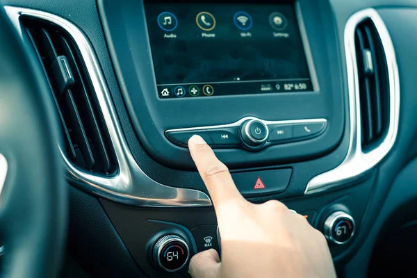 Male hand press the Previous button on modern car dashboard — Stock Photo, Image
