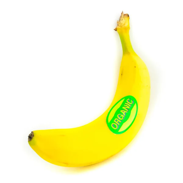 Studio πυροβόλησε οργανική ετικέτα ενιαία ολόκληρη μπανάνα απομονώνονται σε λευκό — Φωτογραφία Αρχείου
