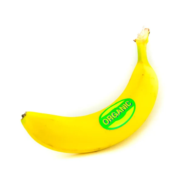 Studio shot organic labeled single whole banana isolated on white — 스톡 사진