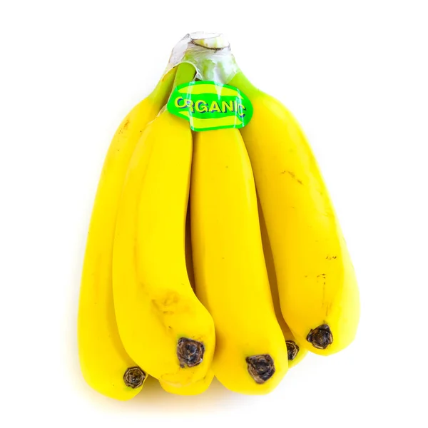 Studio záběr organické označené banán cluster izolované na bílém — Stock fotografie