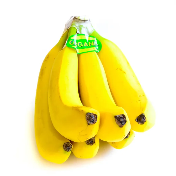 Grappe de bananes biologiques étiquetées Studio isolé sur blanc — Photo