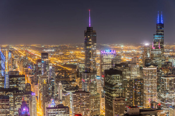 Downtown Chicago illuminated skylines at evening. Aerial view beautiful Chicago cityscape from observation desk.