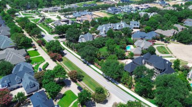 Available lot and luxury homes under construction in Colleyville, Texas, large backyards, swimming pools, mature trees, showcasing active development in high-end suburban community North Dallas. USA
