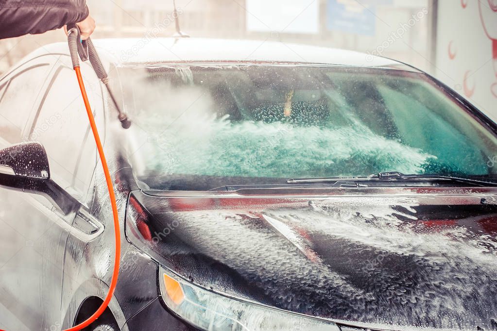 Car washing. Cleaning Car Using High Pressure Water.