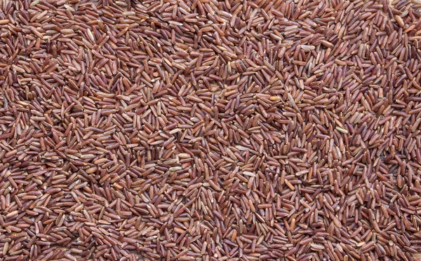 Fondo de arroz, primer plano de arroz rojo, Vista superior — Foto de Stock