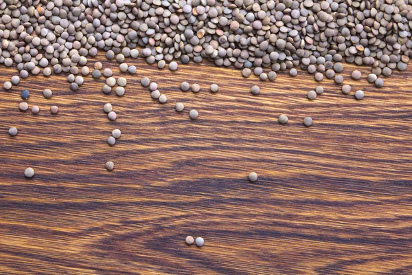 木製の背景上部 Wiew の赤いヒヨコ豆種子 — ストック写真
