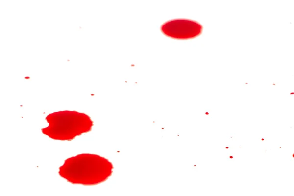 Droppar av röd blod på vitt papper — Stockfoto
