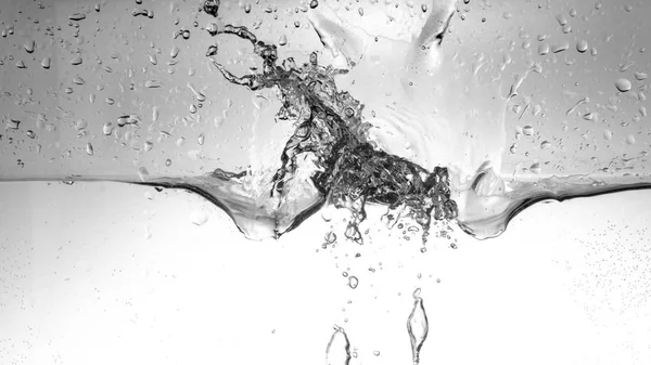 Water splash isolated on white. Close up of splash of water isolated on white background.