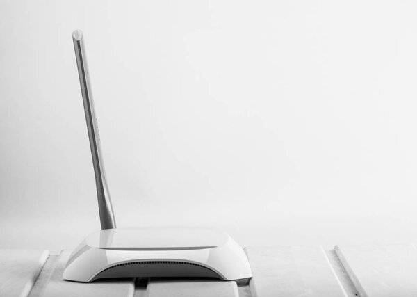 isolated white access point on table in office close up