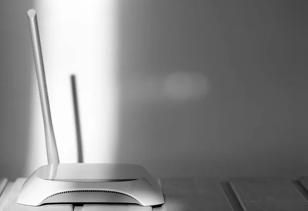 isolated white access point on table in office close up