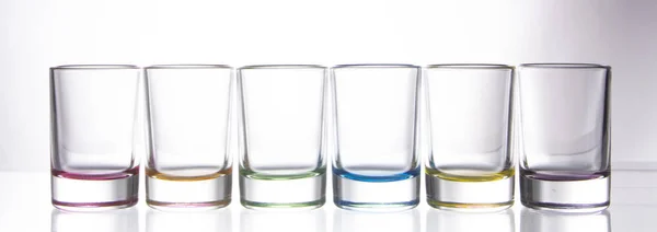 Sex Små Färgglada Glas Vit Bakgrund Nära Håll — Stockfoto