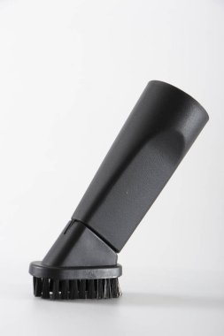 Elektrik süpürgesi beyaz bir arka plan üzerinde siyah meme yakın çekim