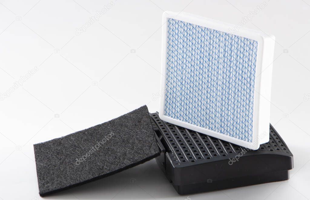dirty dust filter. vacuum cleaner filter on white background