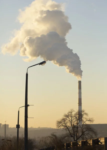 Pollution. Smoke from industrial chimneys against the blue sky