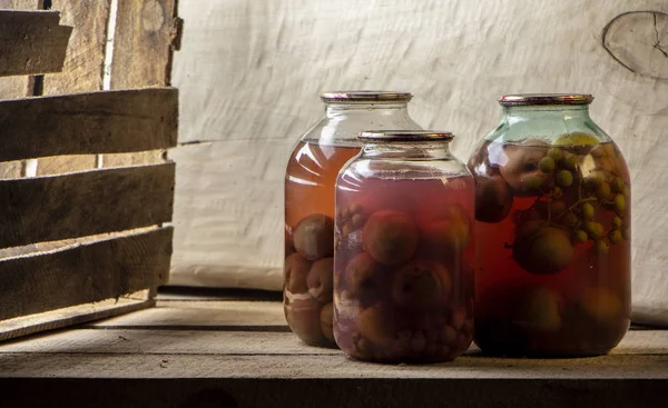 Several Cans Compote Wooden Shelf Dark Basement Close — Zdjęcie stockowe