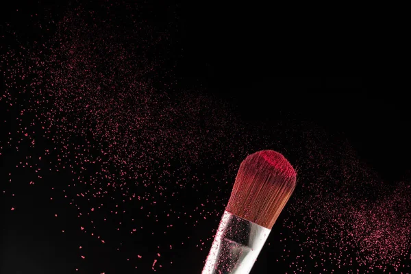 powder splash and brush for makeup artist or beauty blogger in black background