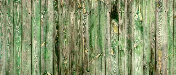 Old wooden wall background or texture The old wooden walls painted green.